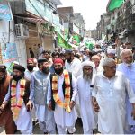 A large number of people participate in a rally celebrating the 12th Rabi-ul-Awwal, Eid Milad-un-Nabi (the birth anniversary of Prophet Muhammad ﷺ)