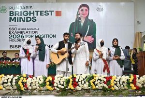 Commissioner Sargodha Hafiz Shaukat Ali and Chairman Board of Intermediate and Secondary Education (BISE) Sargodha Abbas Haider Gondal present an award to the first position holder in the Matriculation Examination 2026 during a prize distribution ceremony at the BISE Multipurpose Hall.