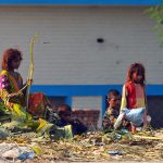 Gypsy children search for recyclable and valuable items in a roadside garbage heap near Vehari Chowk to earn a livelihood in the city