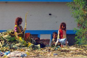 Gypsy children search for recyclable and valuable items in a roadside garbage heap near Vehari Chowk to earn a livelihood in the city