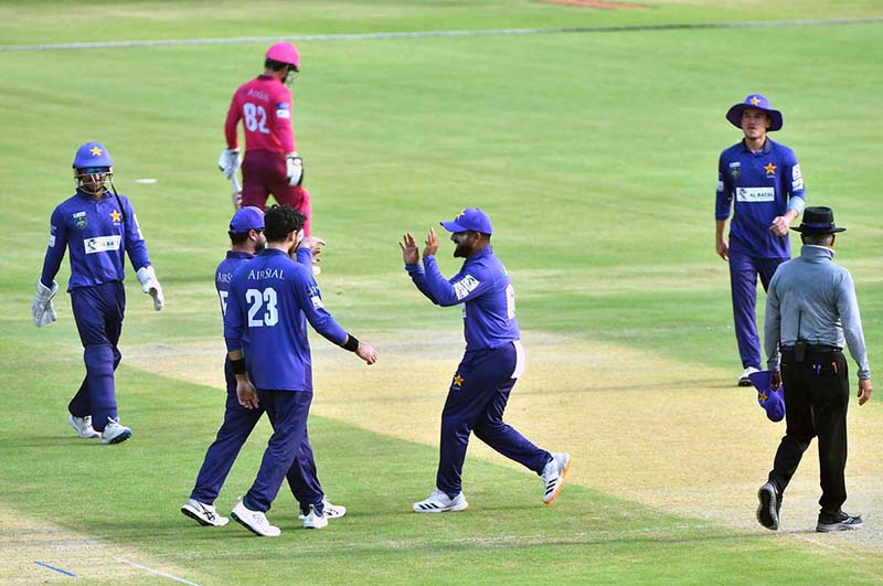 Players celebrate after taking a wicket during the National Champions Cup 2026–27 match between Pakistan Blues and Pakistan Gold at Multan Cricket Stadium