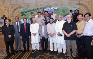 Chairman Sialkot Medical City Khawaja Masood Akhtar presenting a sheild to Defense Minister Khawaja Muhammad Asif