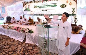 A female Naat Khuwan recites a Naat during a Seerat-un-Nabi (PBUH) Naat Khwani and Qiraat competition organized in connection with Rabi-ul-Awwal at Eidgah.