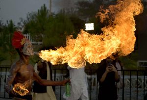 A fire-breather creates a spectacular fireball as he performs during the full-dress rehearsal for Pakistan’s 79th Independence Day celebrations at D-Chowk in the federal capital.