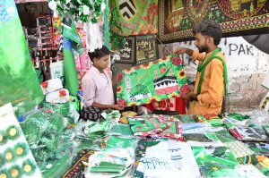 A vendor displaying flags and other stuff to attract the customers in connection with Eid Milad-un-Nabi (PBUH) celebrations.