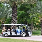 Families enjoy a holiday outing at Race Course Park during pleasant weather in the city