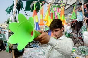 A vendor display and sells pressure horns along the roadside at Saddar market despite a ban imposed by the authorities during the Independence Day celebrations