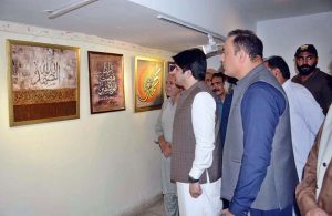 Visitors view a calligraphy exhibition organized in connection with the Jashn-e-Eid Milad-un-Nabi (PBUH) celebrations at the Arts Council.