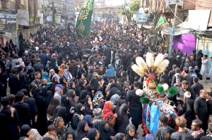 A large number of mourners attending the procession of “Chup Tazia” outside Qadamgah Moula Ali
