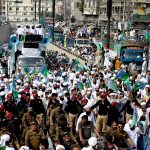 A large number of people participate in a religious procession to celebrate Eid-e-Milad-un-Nabi, the birthday of Prophet Muhammad (PBUH), on the 12th Rabi-ul-Awwal
