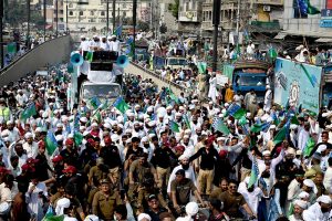 A large number of people participate in a religious procession to celebrate Eid-e-Milad-un-Nabi, the birthday of Prophet Muhammad (PBUH), on the 12th Rabi-ul-Awwal
