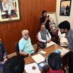 Defence Minister Khawaja Muhammad Asif listens to public grievances during a meeting with residents at his residence in Cantt