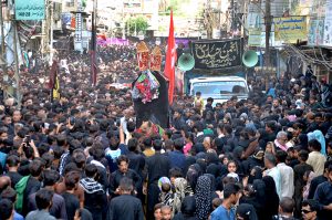A large number of mourners attending the procession of “Chup Tazia” outside Qadamgah Moula Ali