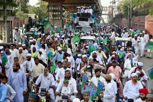 A large number of people participate in a religious procession to celebrate Eid-e-Milad-un-Nabi, the birthday of Prophet Muhammad (PBUH), on the 12th Rabi-ul-Awwal