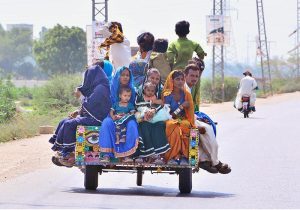 A gypsy family busy in preparing temporary hut for living outside road at Makki Shah Area