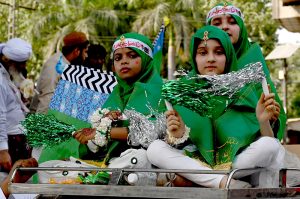 A large number of people participate in a religious procession to celebrate Eid-e-Milad-un-Nabi, the birthday of Prophet Muhammad (PBUH), on the 12th Rabi-ul-Awwal