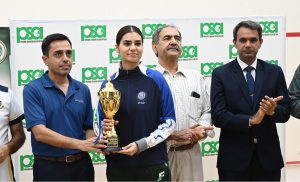Deputy Commissioner Captain(R) Ali Ijaz is distributing trophies to successful players on the occasion of Independence Day match at Punjab Squash Club