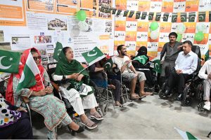 Persons with disabilities perform national songs during the Independence Day commemoration of Pakistan organized by the DIA Welfare Association