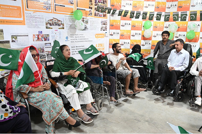 Persons with disabilities perform national songs during the Independence Day commemoration of Pakistan organized by the DIA Welfare Association