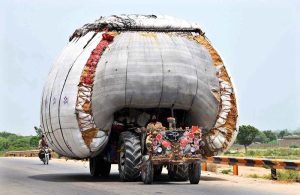 A view of tractor trolley loaded with chaff (husk from wheat) on the way at Larkana-Shikar pur Road.