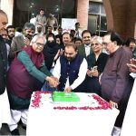 Federal Minister for National Heritage and Culture Aurangzeb Khan Khichi cuts a cake during the third “Nasl-e-Nau Adabi Mela” at the Pakistan Academy of Letters