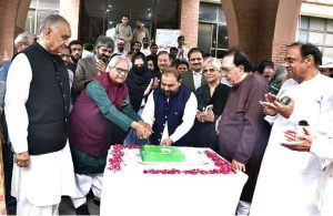 Federal Minister for National Heritage and Culture Aurangzeb Khan Khichi cuts a cake during the third “Nasl-e-Nau Adabi Mela” at the Pakistan Academy of Letters