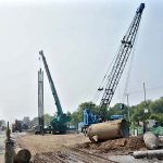 Heavy machinery is deployed for ongoing development and construction work on Jaranwala Road as part of the Metro project