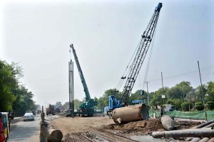 Heavy machinery is deployed for ongoing development and construction work on Jaranwala Road as part of the Metro project