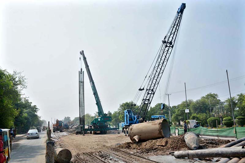Heavy machinery is deployed for ongoing development and construction work on Jaranwala Road as part of the Metro project