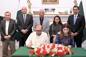 Governor Sindh Syed Muhammad Nehal Hashmi and Federal Minister for IT and Telecommunications Shaza Fatima Khawaja witness the signing of a MoU between NED University of Engineering and Technology and the Pakistan Software Export Board (PSEB) at Governor House to promote partnership in the technology sector