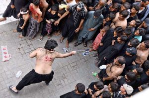 Shia mourners perform zanjeer zani during the Chehlum procession commemorating the martyrdom of Hazrat Imam Hussain (RA), the grandson of the Holy Prophet Muhammad (PBUH).