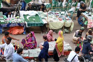 hopkeepers are busy in selling national flags, badges, pennants, and other items reflecting patriotic spirit for sale, as the nation prepares to celebrate Pakistan's Independence Day with traditional zeal and enthusiasm.