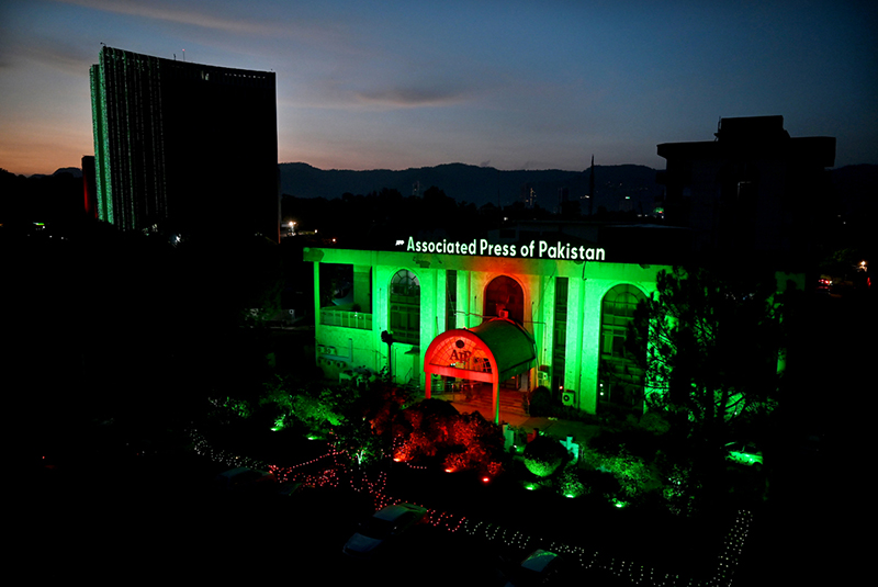 The building of the Associated Press of Pakistan (APP) is illuminated in green and red lights on the eve of celebrations marking the Makkah Joint Defence Agreement, signed by Pakistan, Saudi Arabia, and Türkiye on August 7, 2026, at Al-Safa Palace in Makkah