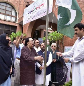Federal Minister for National Heritage and Culture Aurangzeb Khan Khichi cuts a cake during the third “Nasl-e-Nau Adabi Mela” at the Pakistan Academy of Letters