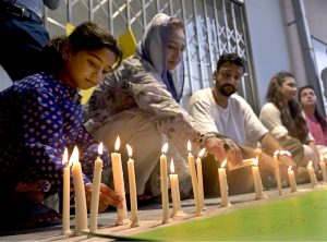 Civil society members hold a candlelight vigil outside the nursery of the Children’s Hospital at Pakistan Institute of Medical Sciences (PIMS), where 14 newborns lost their lives in a fire incident a day earlier