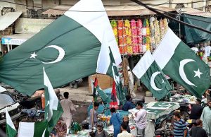 hopkeepers are busy in selling national flags, badges, pennants, and other items reflecting patriotic spirit for sale, as the nation prepares to celebrate Pakistan's Independence Day with traditional zeal and enthusiasm.