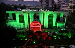 The building of the Associated Press of Pakistan (APP) is illuminated in green and red lights on the eve of celebrations marking the Makkah Joint Defence Agreement, signed by Pakistan, Saudi Arabia, and Türkiye on August 7, 2026, at Al-Safa Palace in Makkah