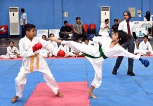 Young karate players compete during the Pakistan Independence Celebrations U-14 Kids Sports Gala organized by the Sports Department at the Sports Gymnasium