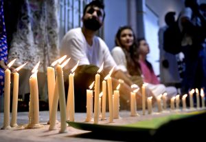 Civil society members hold a candlelight vigil outside the nursery of the Children’s Hospital at Pakistan Institute of Medical Sciences (PIMS), where 14 newborns lost their lives in a fire incident a day earlier