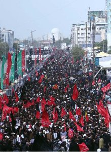 A mourning procession of the Shia community passes along M.A. Jinnah Road during the Chehlum observance commemorating the martyrdom of Hazrat Imam Hussain (AS).