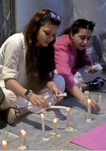 Civil society members hold a candlelight vigil outside the nursery of the Children’s Hospital at Pakistan Institute of Medical Sciences (PIMS), where 14 newborns lost their lives in a fire incident a day earlier