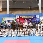 Divisional Sports Officer Rana Nadeem Anjum, District Sports Officer Saima Manzoor and Divisional Secretary Karate Association Muhammad Naeem Khan pose for a group photo with players during the Pakistan Independence Celebrations U-14 Kids Sports Gala organized by Sports department held at sports gymnasium