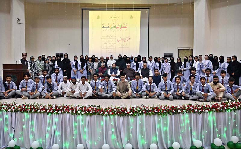 Federal Minister for National Heritage and Culture Aurangzeb Khan Khichi poses for a group photograph with students and teachers the opening ceremony of the third “Nasl-e-Nau Adabi Mela” at the Pakistan Academy of Letters
