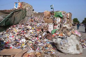 Gypsies sort through garbage at a waste dump along Canal Road.