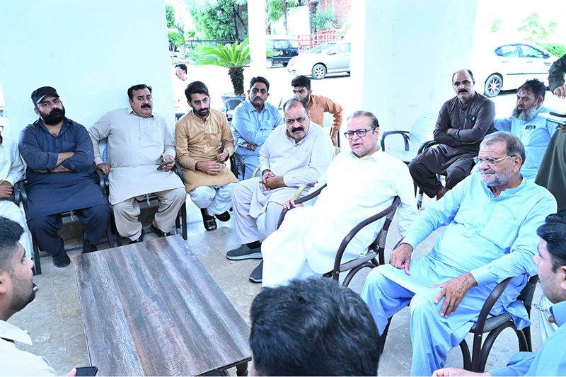 Minister of State for Planning and Development Chaudhry Armaghan Subhani listens to the problems and concerns of people at his Dera Vario