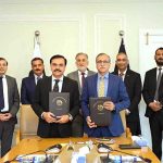 Amjad Majeed Aulakh (DG Operations, NAB) and Jawad Ahmad Dogar (DG, NFA) showing MoU after signing it in the presence of Chairman NAB Lt. Gen (R) Nazir Ahmed and Senior officers of NAB & NFA at NAB Headquarters