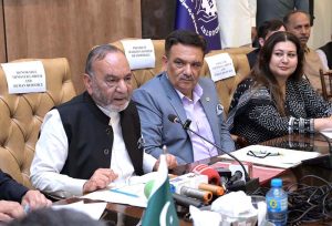 Provincial Minister for Labour and Manpower Punjab Muhammad Manshaullah Butt addresses a ceremony for the distribution of cheques among workers at the Sialkot Chamber of Commerce and Industry (SCCI).