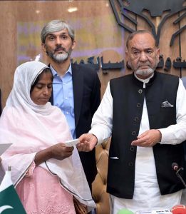 Provincial Minister for Labour and Manpower Punjab Muhammad Manshaullah Butt addresses a ceremony for the distribution of cheques among workers at the Sialkot Chamber of Commerce and Industry (SCCI).