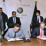 Secretary of the Ministry of Economic Affairs, Muhammad Humair Karim and Japanese Ambassador to Pakistan, Akamatsu Shuichi sign the Record of Discussion and Exchange of Notes for the JDS Scholarship Program