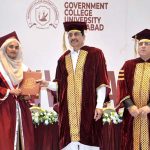 Sindh Minister for Universities and Boards Department Muhammad Ismail Rahoo awards a degree to a successful graduate during the third convocation of Government College University, Hyderabad